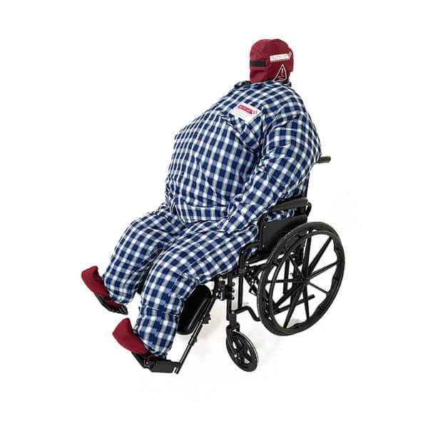 Training dummy in checkered outfit sitting in wheelchair.