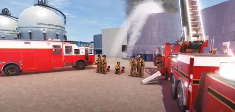 Response Simulator - Firefighters battling industrial blaze with fire trucks.
