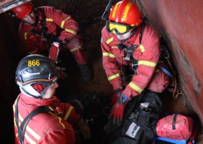 Firefighters in confined space training exercise.