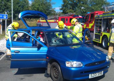 Firefighters training responding to a car accident on M999 motorway.