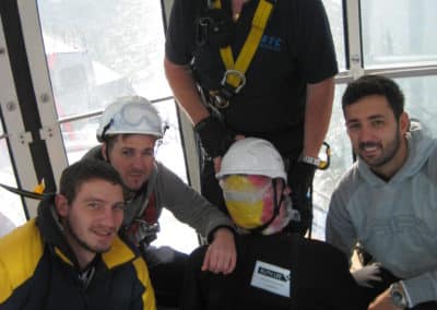 Group of rescue workers with training mannequin.