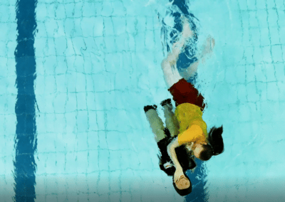Pool Rescue Training Manikin with lifeguard in pool