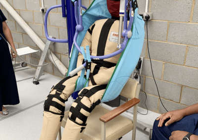 Patient lift demonstration with dummy in a medical centre.