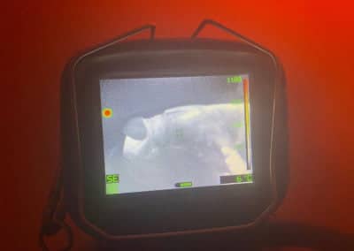 Thermal imaging screen showing a firefighter in action.
