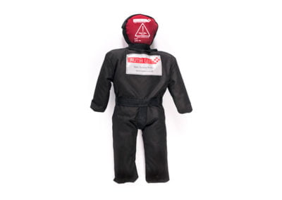 Rescue training manikin in black and red uniform.