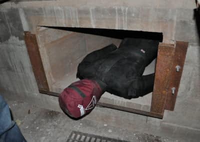 Rescue scenario: mannequin stuck in a concrete vent.