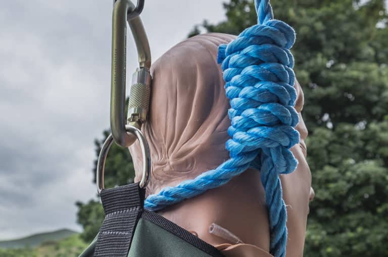 Training dummy secured with a blue rope.