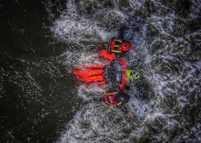 Rescue team assisting in water