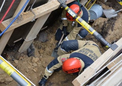 Rescue team members digging during an emergency operation.