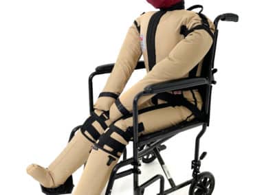 Training dummy seated in wheelchair for rescue practice.