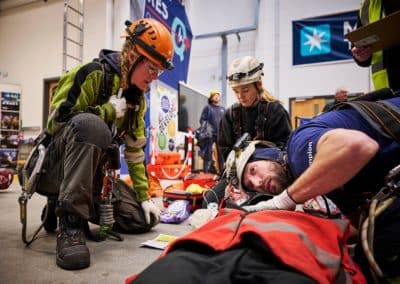 Rescue team practices emergency response with equipment.