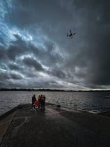 FReD Rescue team and drone by stormy lake
