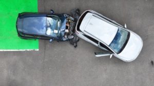 Two cars involved in a collision from above.